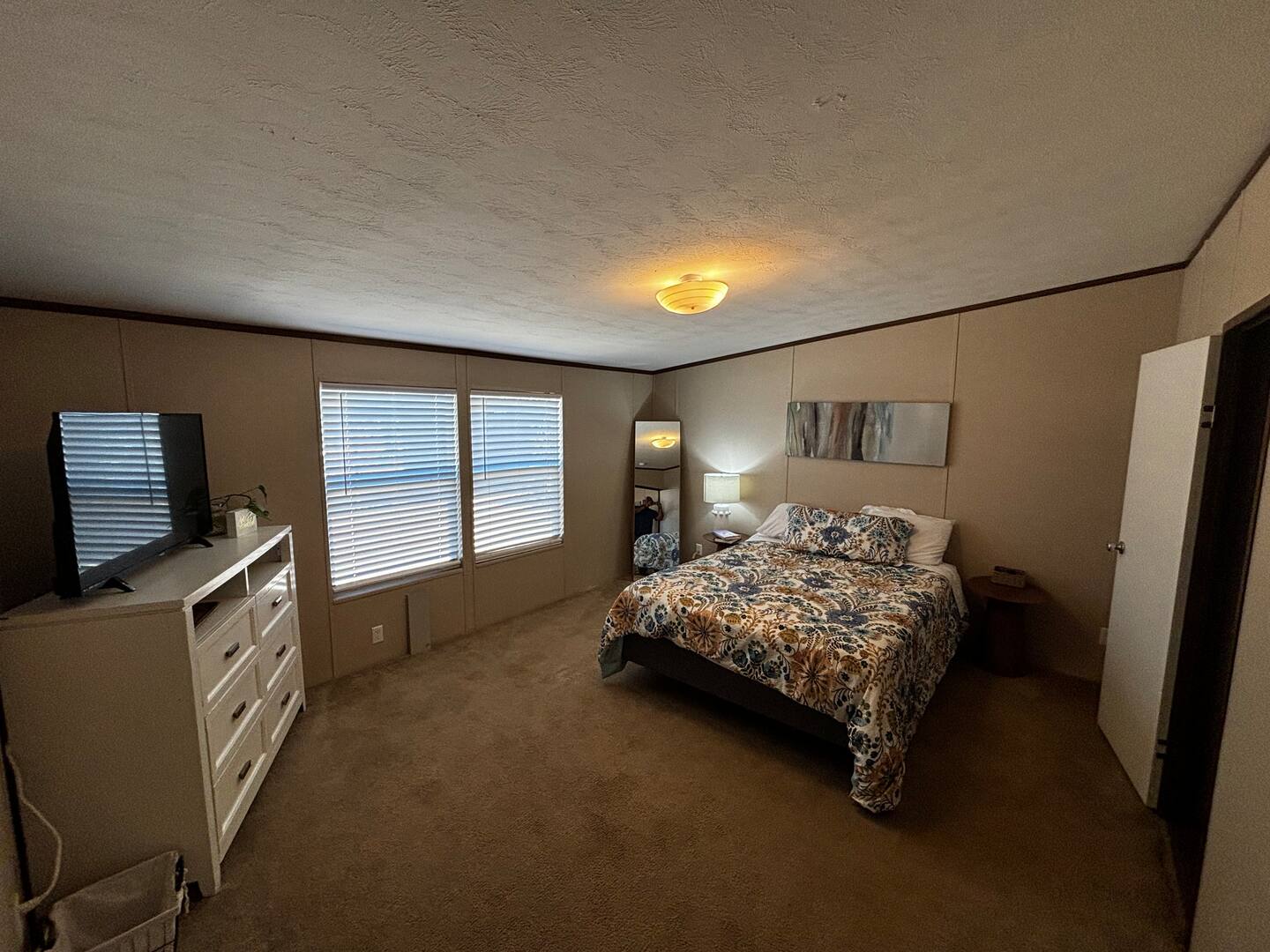 Primary bedroom at Peppergrass Retreat Airbnb